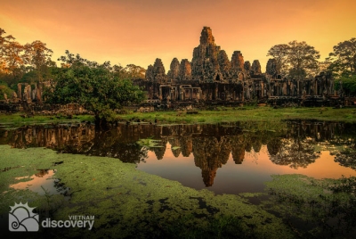Majestic Bayon Temple at the sunset - Indochina Tour from Vietnam