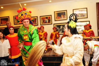 Tourist try performing Tuong - Vietnam culture tour 1