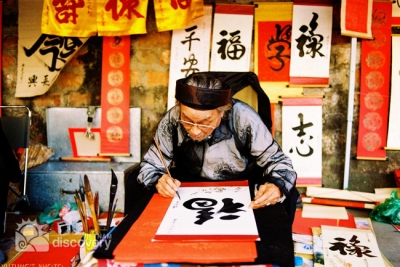 Old scholar in the old quarter on Vietnamese Tet - travel to Vietnam